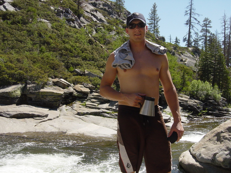Man standing at the river with a mug, 2006
