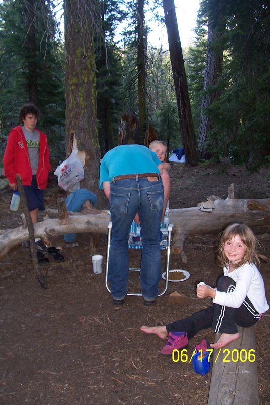 Kids and adults at camp in the evening, 2006, dated 06/17/2006