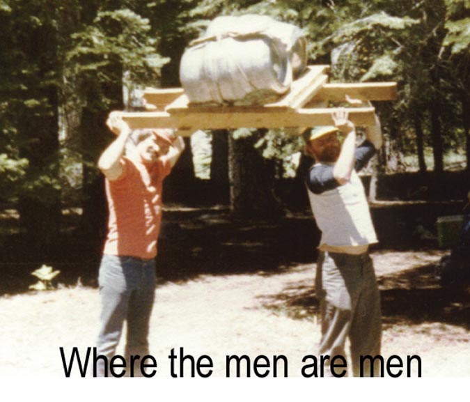 Two men hoisting a keg on the original wooden stretcher overhead