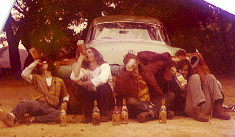 The TBO crew relaxing with tequila bottles, mid-1970s